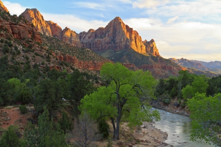 The last rays of sun hit The Watchman mountain with the Virgin River in the foreground in ZIon National Park, Utahの写真素材