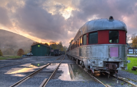 The Delaware & Ulster Railroad Rip Van Winkle Flyer as a storm clears at sunset, in Arkville, NY