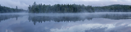 Foggy morning on  Seventh Lake in the Fulton Chain Lakes region of the Adirondack Mountains of New Yorkの写真素材