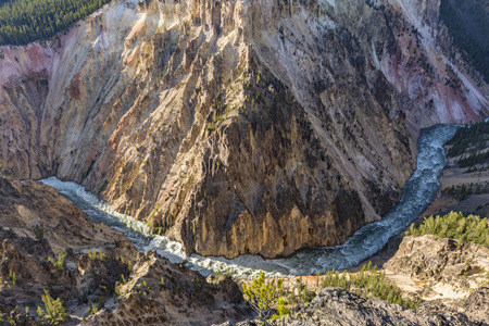 A wide, sweeping turn of the raging Yellowstone River below Inspiration Point in Yellowstone National Park, Wyomingの写真素材