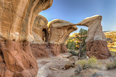 Unique Metate Arch in Devil's Garden in Grand Staircase Escalante National Monument, off near Escalante, Utah.の写真素材