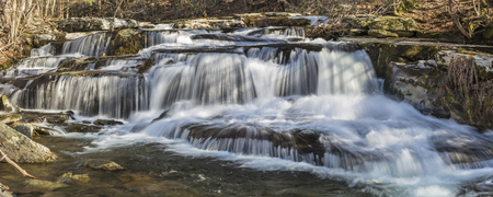 Panoramic image of a multi-tiered waterfalls on Stony Clove Creek in Greene Country in the Catskill Mountains in Edgewood, New Yorkの写真素材