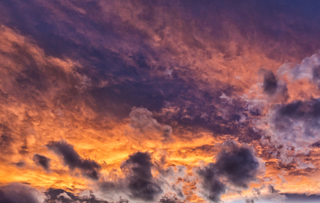 Unusual layers of colorful clouds at sunset over Stearns Lake in Broomfield, Coloradoの写真素材
