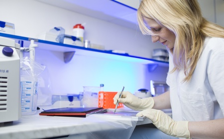 portrait of a female researcher doing research in a lab 
