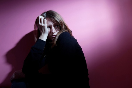 Young woman suffering from severe depressionの写真素材