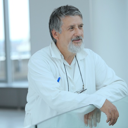 Renowned scientist/doctor in a research center/hospital looking confident