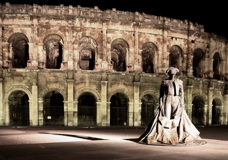 Statue of a famous bullfighter in front of the arena in Nimes, France. (panoramic photo made of multiple shots - huge resolution, very suitable for large prints) Statue of a famous bullfighter in front of the arena in Nimes, France. (panoramic photo made of multiple shots - huge resolution, very suitable for large prints)