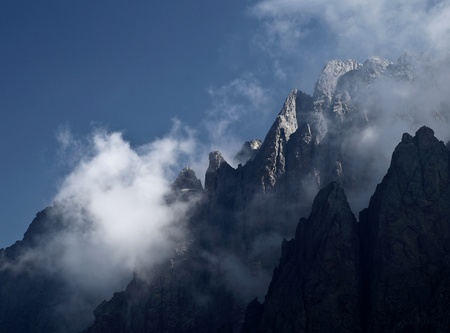 Impressive high mountain view - mountain peaks in mistの写真素材