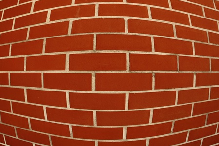 intentionally distorted red wall as a catchy background/textureの写真素材