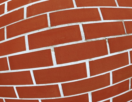 intentionally distorted red wall as a catchy background/textureの写真素材