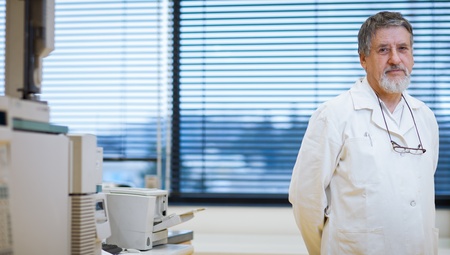 Portrait of renowned scientist/doctor in a research center/hospital laboratory.の写真素材