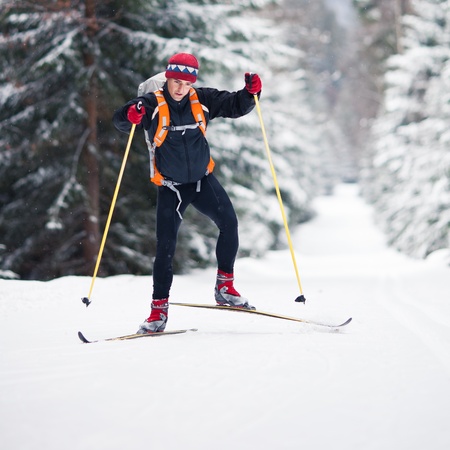 Cross-country skiing: young man cross-country skiing on a lovely sunny winter dayの写真素材
