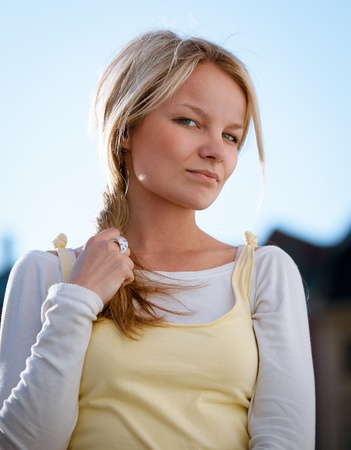 Closeup portrait of a beautiful young woman outdoorの写真素材