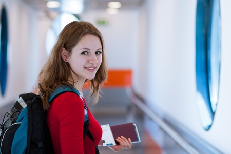 Portrait of a young woman in the boarding bridge, boarding an aircraftの写真素材