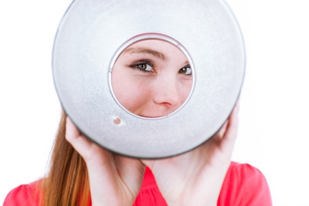 Photo studio concept: young model/photo assistent helping to set up the studioの写真素材