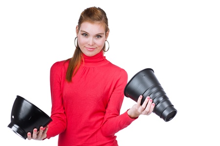 Photo studio concept: young model/photo assistent helping to set up the studioの写真素材