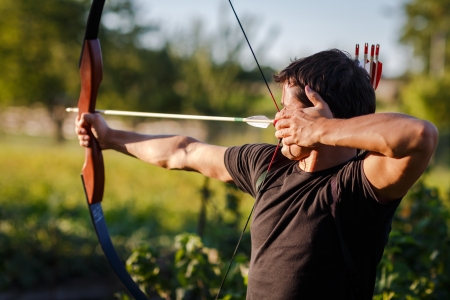 Young archer training with the  bowの写真素材