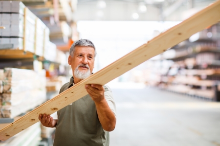 Man buying construction wood in a  DIY storeの写真素材