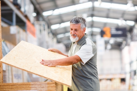 Man buying construction wood in a  DIY storeの写真素材