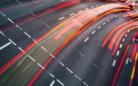 Motion blurred city road traffic (color toned  image)の写真素材