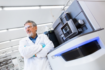 Renowned scientist/doctor in a research center/hospital laboratory looking confident (color toned image shallow DOF)の写真素材