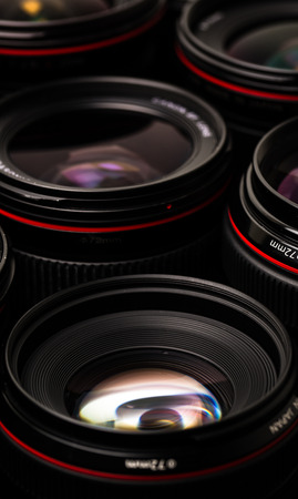 Modern camera lenses with reflectionsの写真素材