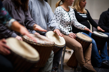 Group of people playing on drums - therapy by musicの写真素材