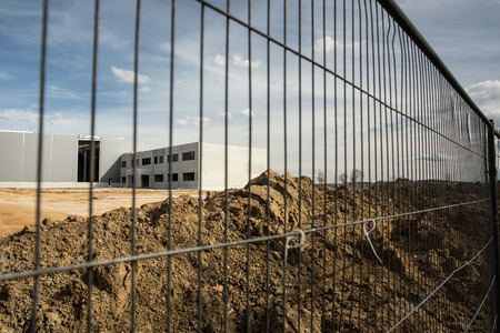 Construction site with a fence around itの写真素材