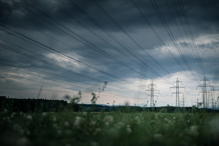 High-voltage power lines. electricity distribution station . high voltage electric transmission tower in landscapeの写真素材