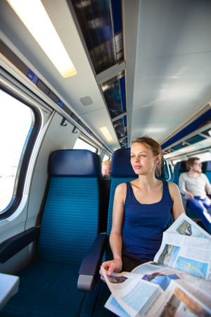 Young woman traveling by trainの写真素材