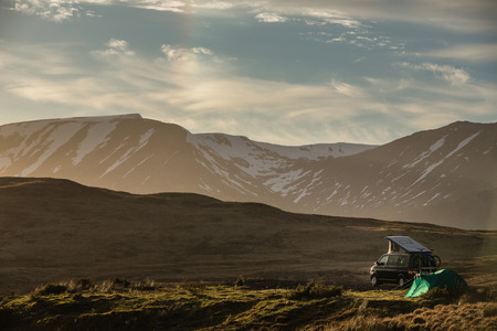 Highlands of Scotland - someone found a lovely spot for tonight - camper and a tent in a splendid landscapeの写真素材
