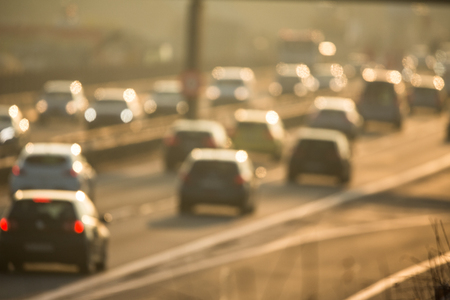 Heavy morning city traffic/congestion concept - cars going very slowly in a traffic jam during the morning rushhour - blurred photoの写真素材
