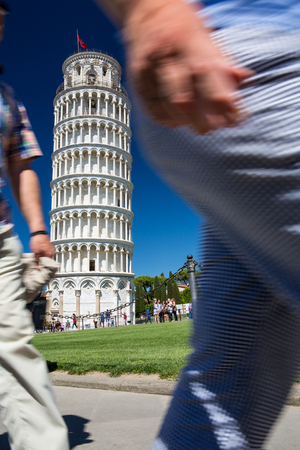 Crowds of tourists visiting the Leaning Tower of Pisa, Tuscany, Italy (motion blur technique used to convey the incessant influx of tourist to this landmark)の写真素材