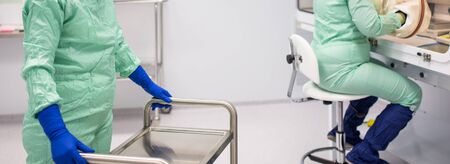 Cytostatic meds being prepared in a super clean lab environment - (shallow DOF; color toned image)