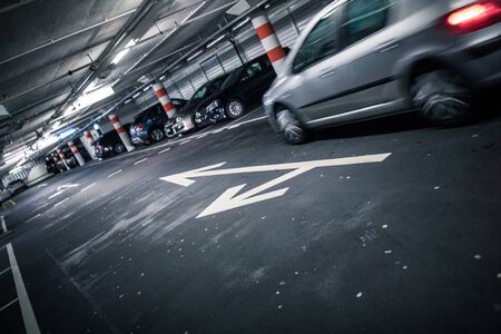 Underground parking/garage (shallow DOF; color toned image)の写真素材