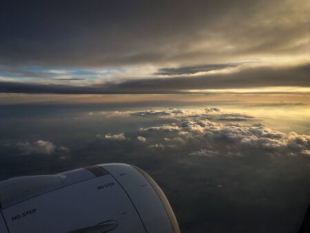 View of the sky and clouds from the airplane porthole. jet engine turbine look through aircraft...