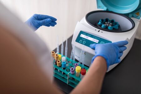 Nurse in a lab carrying out a blood test analysis amid deadly virus pandemic