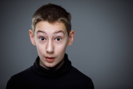 Grief-stricken little boy - feeling intense sorrow, remorse, sadnesss - studio portrait - vivid...
