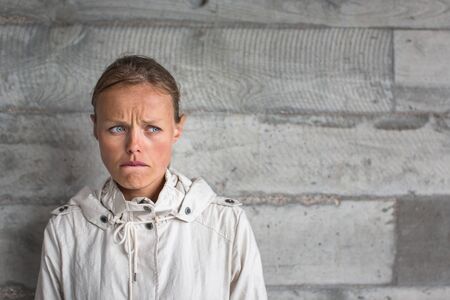 Depressed/anxious young woman suffering from solitude, isolation. Corona virus outbreak situation....