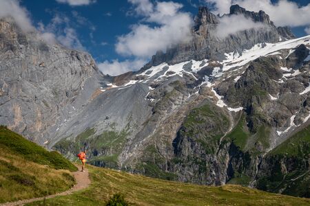 Pretty, female hiker/climber in a lovely alpine setting of Swiss Alpsの写真素材