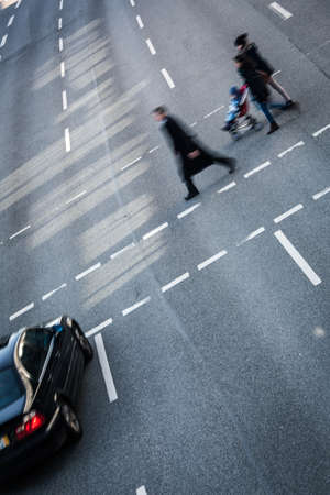 City business people crossing a street - motion blurred abstract backgroundの写真素材