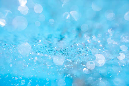 Splashed water wave in clean blue water