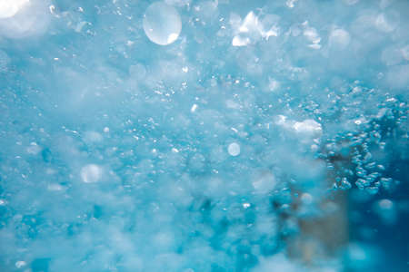 Beautiful water waves -  Splashed water wave in clean blue water, clean filtered water ready for drinkingの写真素材