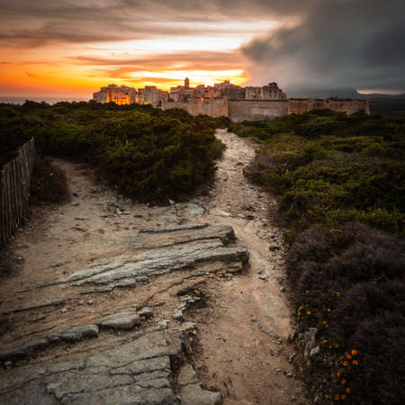 Sunset and storm over the Old Town of Bonifacio, the limestone cliff, South Coast of Corsica Island, Franceの写真素材