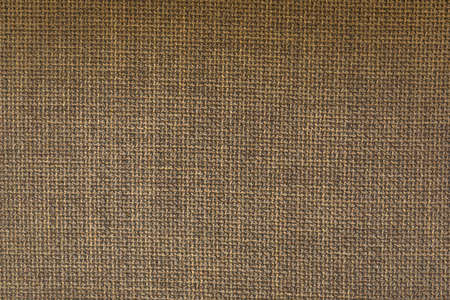 Natural fabric of brown color. Close-up long and wide texture of natural fabric. Fabric texture of natural cotton or linen textile materialの写真素材