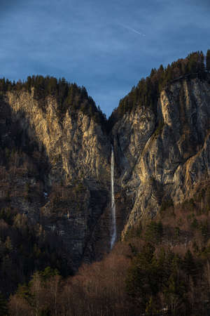 High waterfall within alpine scenery in Switzerlandの写真素材