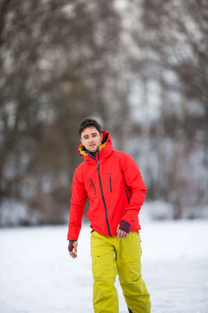 Young man ice skating outdoors on a pond on a freezing winter dayの写真素材