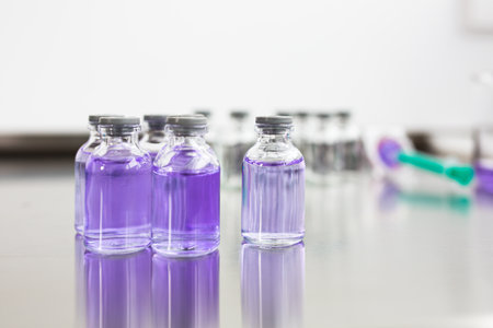 Flasks with liquids in a lab - Pharmaceutical industry factory and production laboratory (color toned image; shallow DOF)の写真素材
