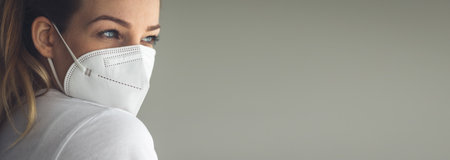 Young woman wearing  a facemask during  and flu outbreak.の写真素材