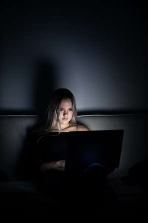 Teenage girl studying in a virtual class. Distance education and learning, e-learning, online learning concept during quarantine, pandemicsの写真素材